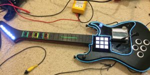 Guitar Hero controller modified into a MIDI controller and covered in flashy lights!